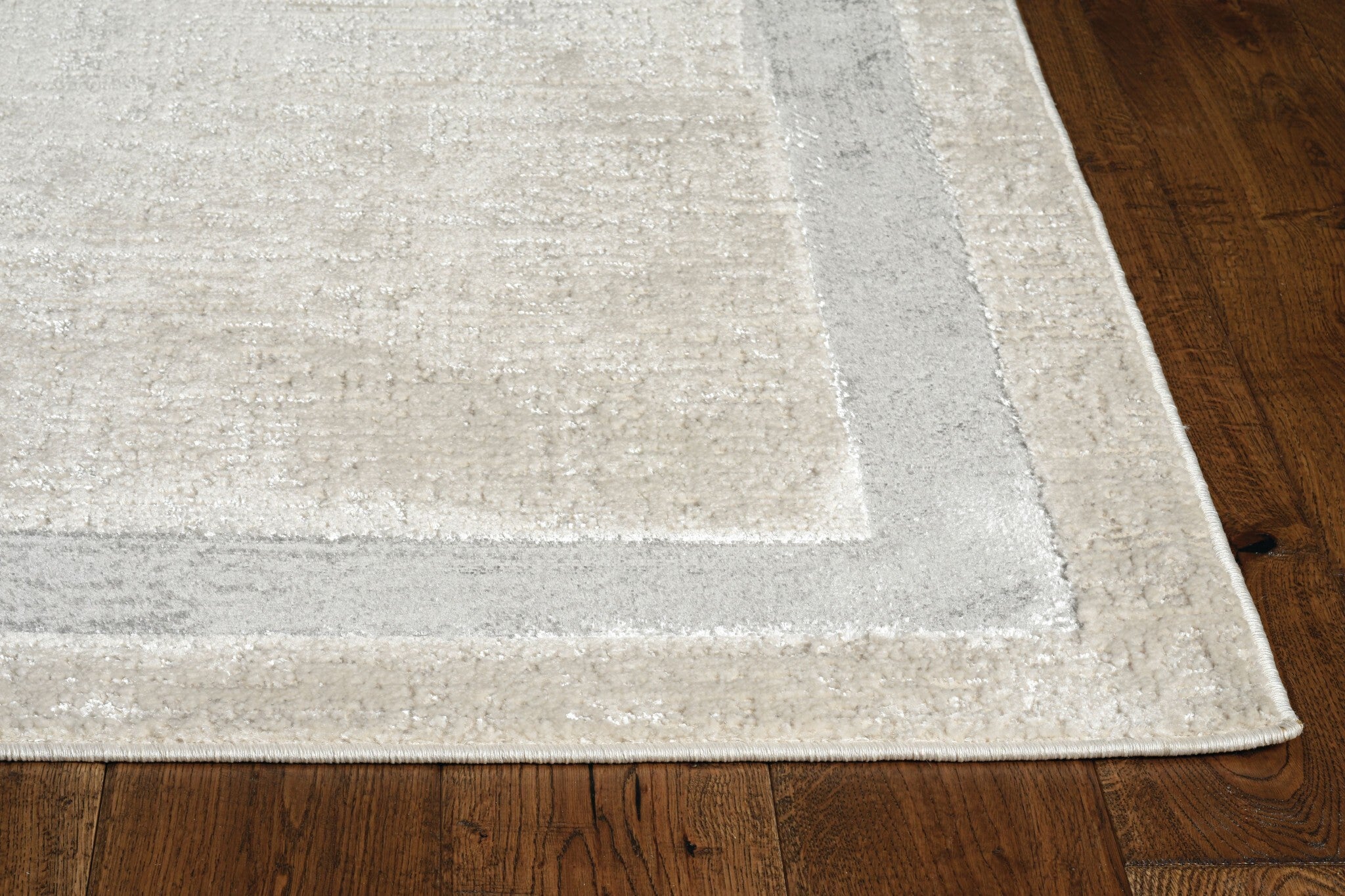 10'X13' Ivory Silver Machine Woven Bordered Indoor Area Rug