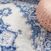 5' X 7' Ivory And Blue Persian Medallion Area Rug