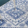 4' X 6' Ivory And Navy Geometric Area Rug