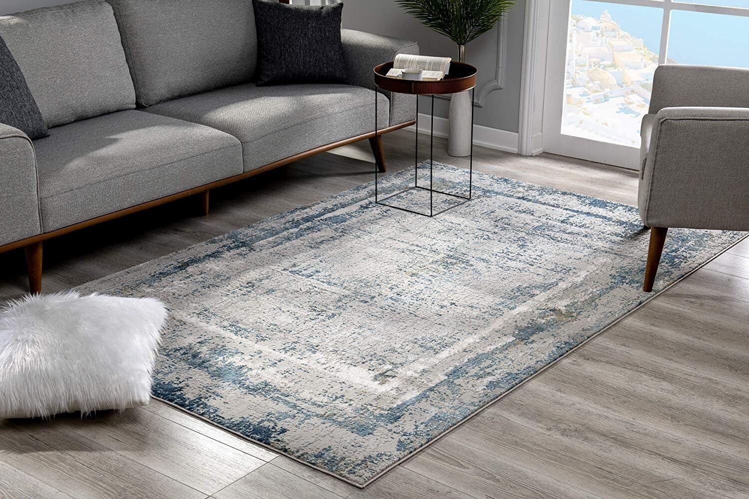 5' X 8' Ivory And Blue Abstract Distressed Area Rug
