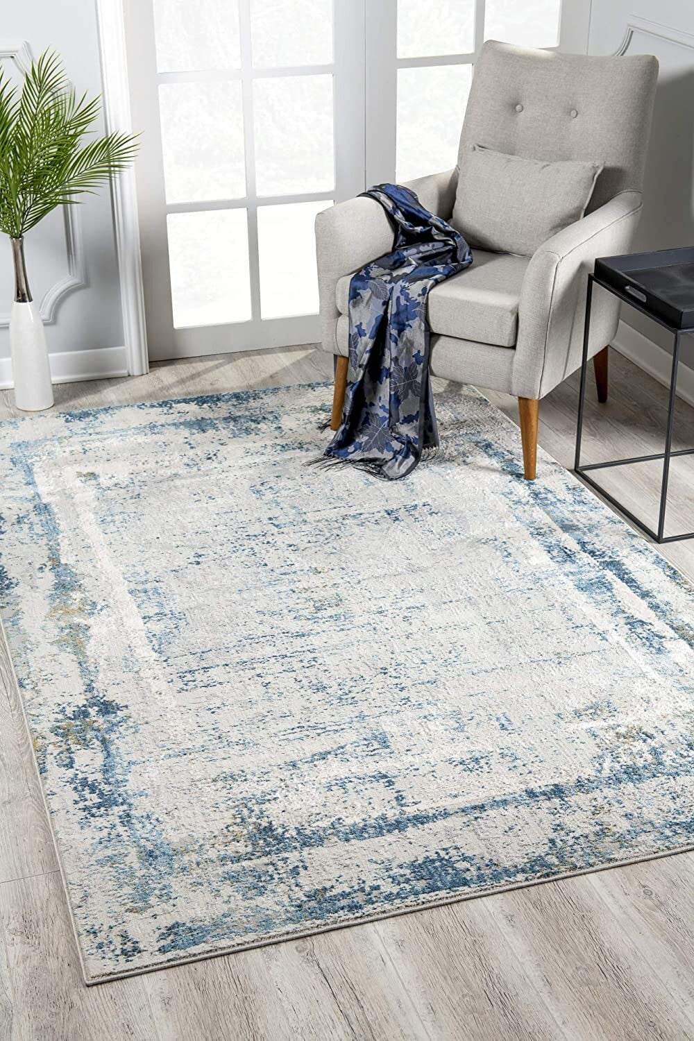 7' X 10' Ivory And Blue Abstract Distressed Area Rug