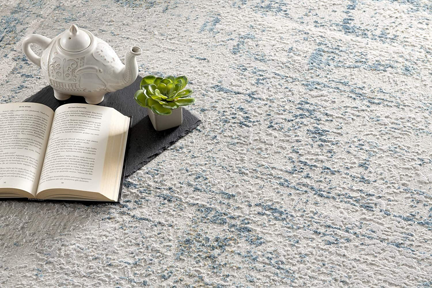 7' X 10' Ivory And Blue Abstract Distressed Area Rug
