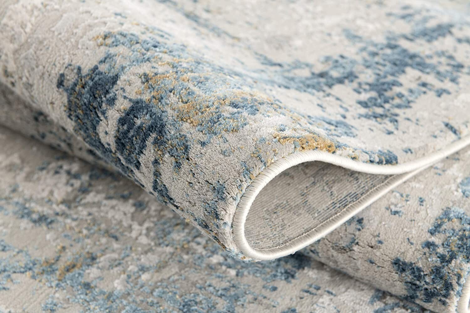 7' X 10' Ivory And Blue Abstract Distressed Area Rug