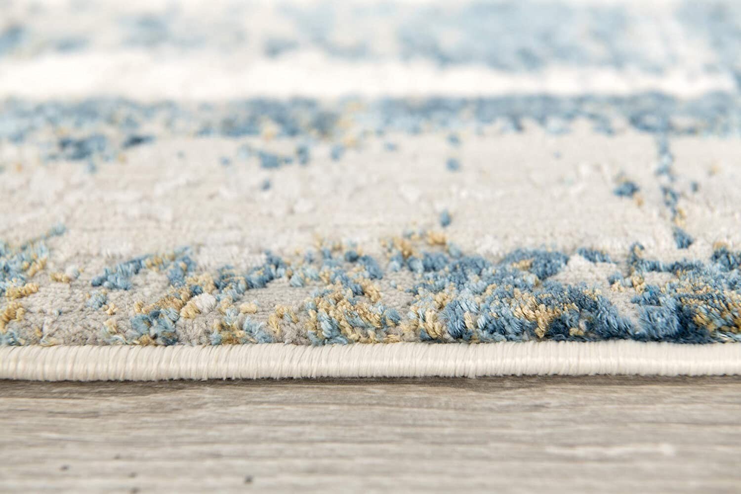 7' X 10' Ivory And Blue Abstract Distressed Area Rug