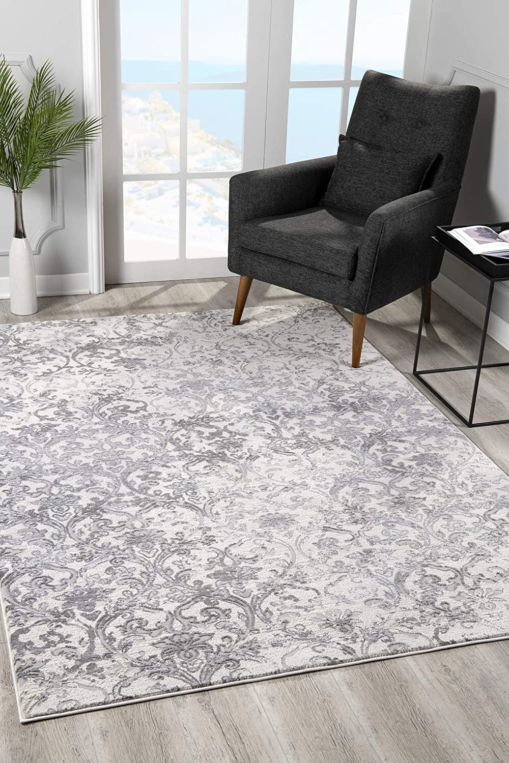 8' X 11' Cream And Gray Faded Filigree Area Rug