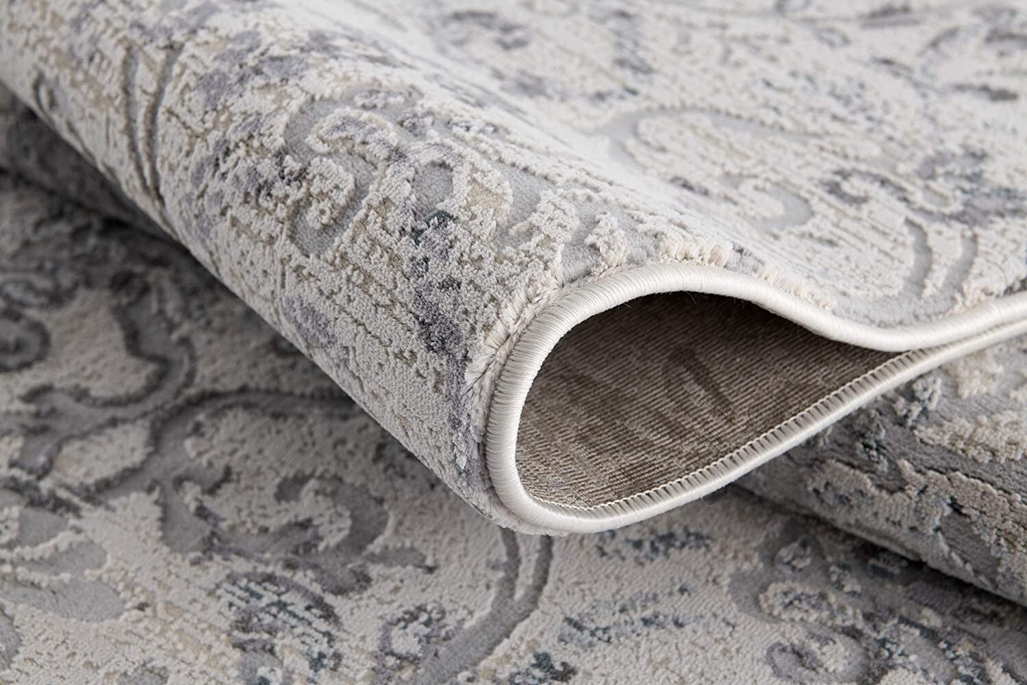 8' X 11' Cream And Gray Faded Filigree Area Rug