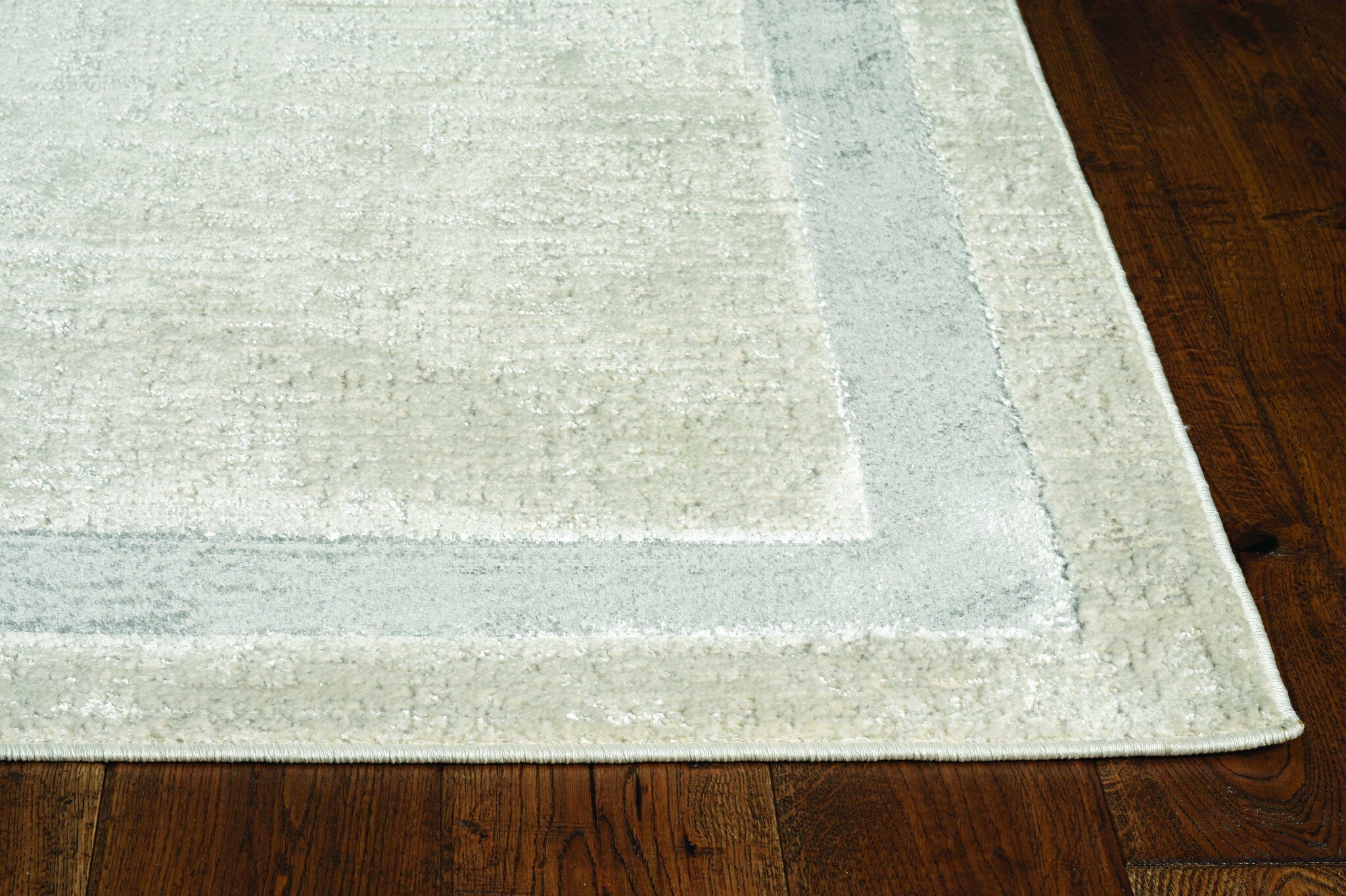 8'X11' Ivory Silver Machine Woven Bordered Indoor Area Rug