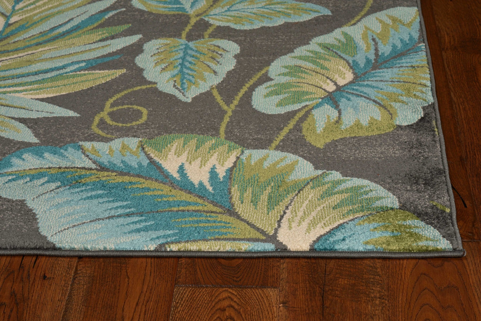 8'X11' Grey Teal Machine Woven Oversized Tropical Leaves Indoor Area Rug