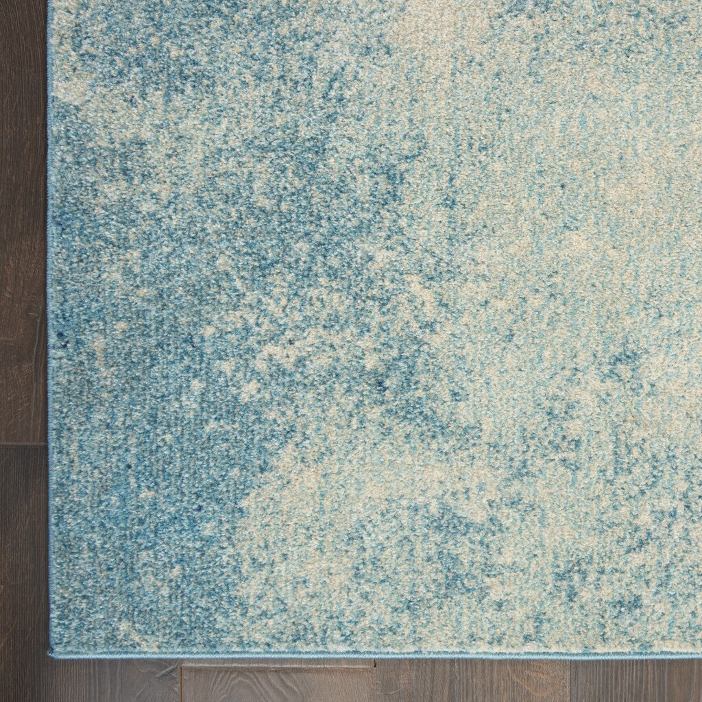 7' X 10' Light Blue And Ivory Abstract Sky Area Rug