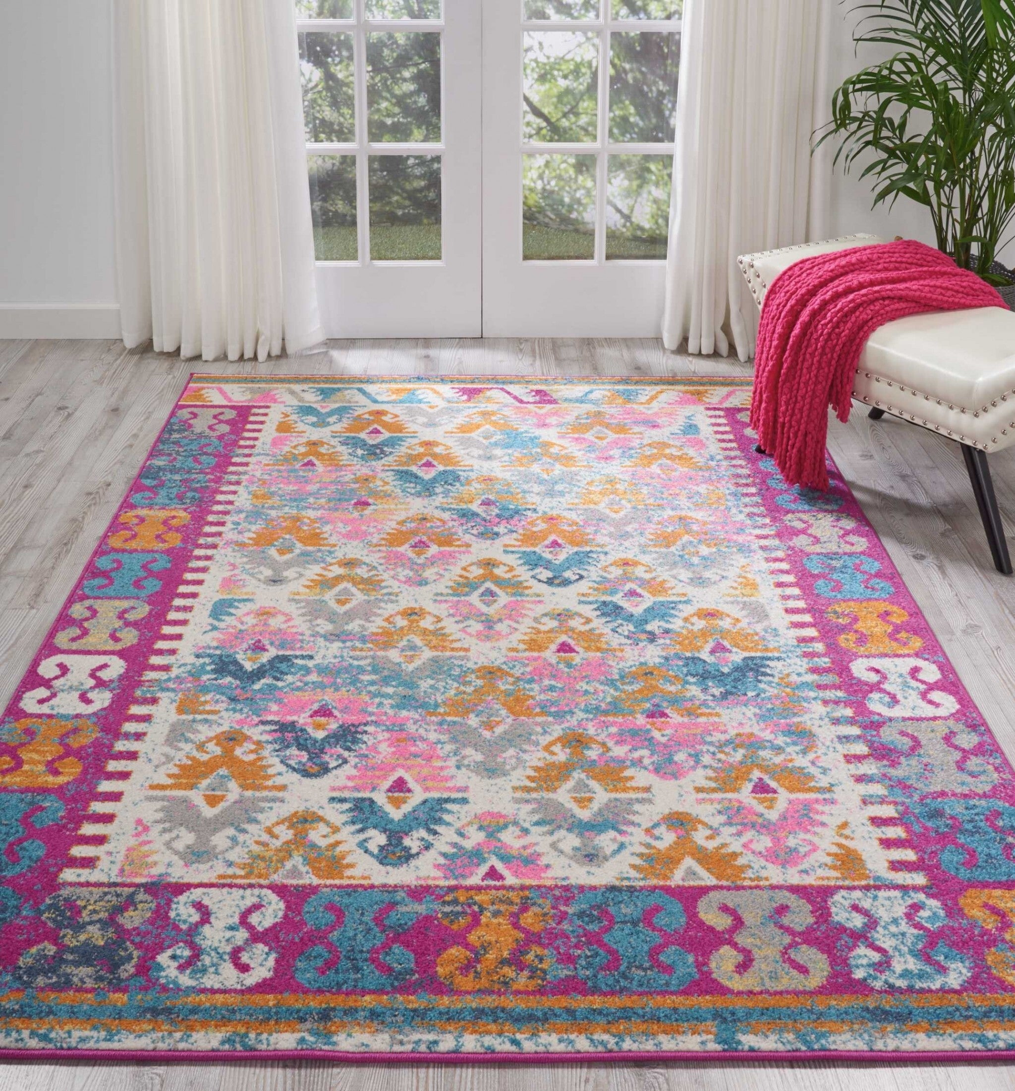 5' X 7' Ivory And Magenta Tribal Pattern Area Rug