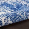6' X 9' Blue And Ivory Abstract Splash Area Rug