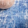 6' X 9' Blue And Ivory Abstract Splash Area Rug