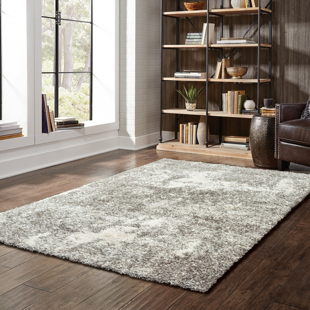 5' X 8' Gray And Ivory Distressed Abstract Area Rug