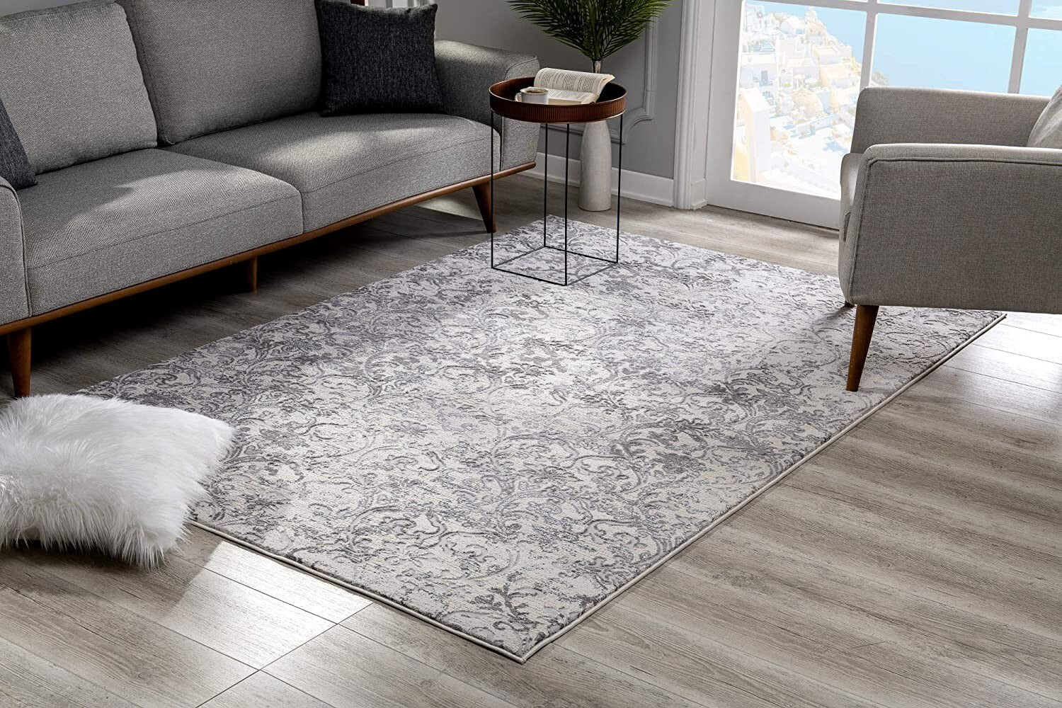 7' X 10' Cream And Gray Faded Filigree Area Rug